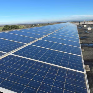 Large rooftop solar panel installation in Helston, Cornwall, by AMP Electrical Solutions.